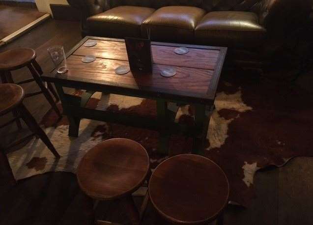 The boar behind the bar wasn’t the only sign of animal life in the bar, I found this cow rug hiding under a table