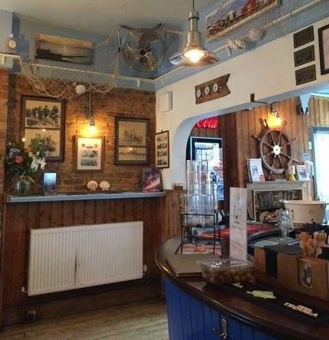 The seaside theme continues in the bar with plenty of historic photos and nets draped across the walls