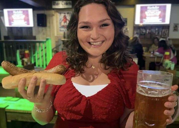 Reporter Megan Carr with her Bratwurst and beer at Bierkeller, Maidstone