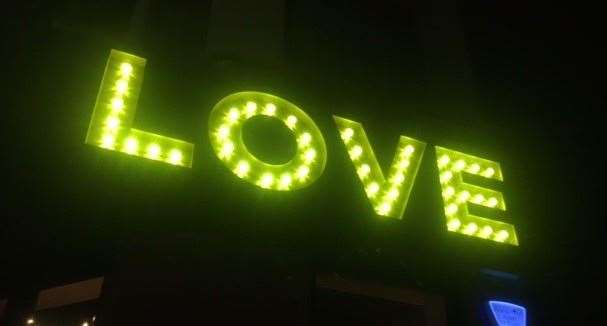 Lit up large in fluorescent green lightbulbs, walking up Marine Gardens in Margate you’re not going to miss the Love Café