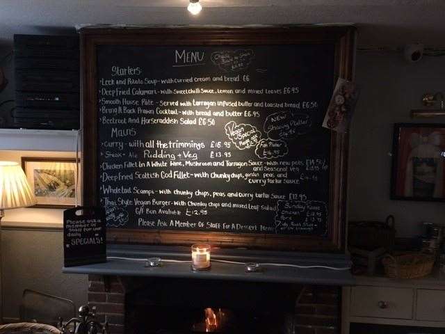 I chose the pickled egg route, but for those wanting something a little more substantial the menu is chalked up on a large board over the fireplace