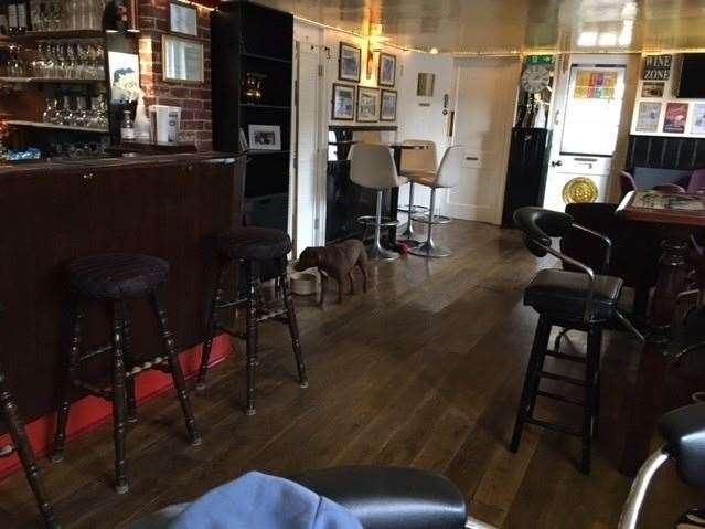 I was left alone with just canine company for a little while. If you look carefully you will spot the door at the far end of the bar marked gents