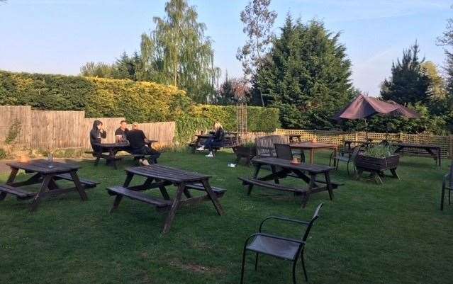 A few hardy souls were braving the early evening sunshine on the far end of pub garden but as soon as they found themselves in the shade they came scurrying back inside
