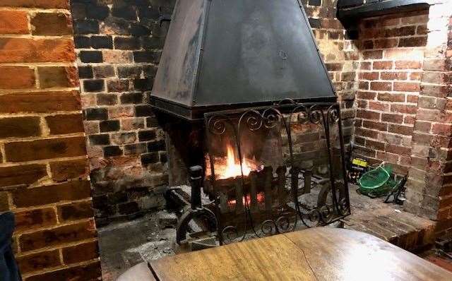 The blackened fireplace had a roaring fire and I managed to find a seat at a table in the perfect position