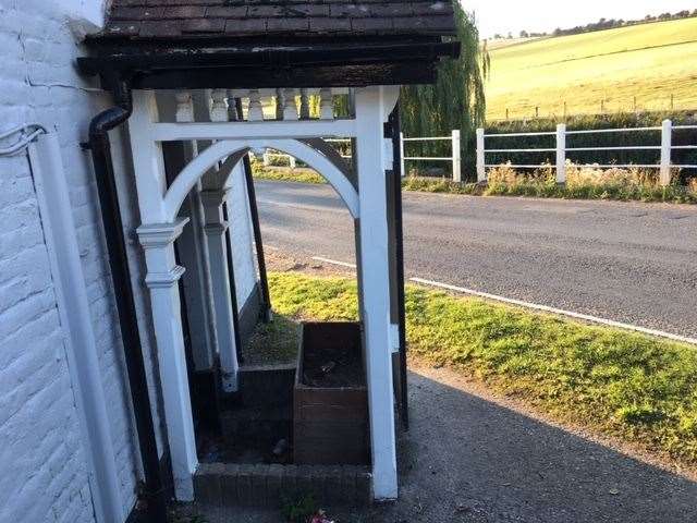 The front entrance porch, near the road, is sensibly decommissioned