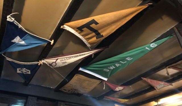 These nautical pennants were decorating the ceilings in a number of rooms
