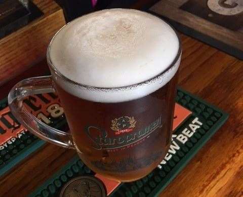 The Staropramen, a slightly darker pilsner lager from the Czech Republic was served with a decent head and did come in a branded glass