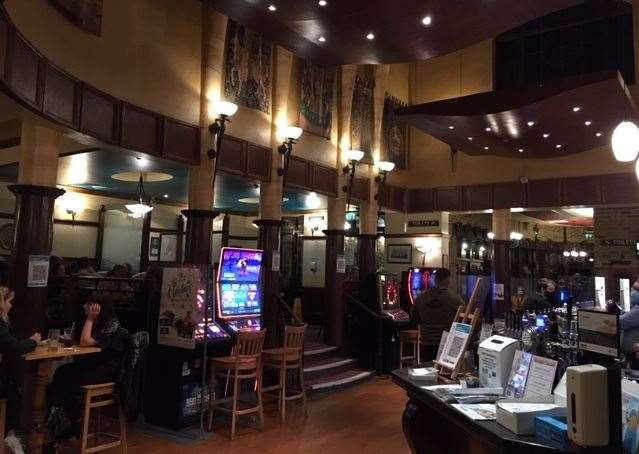 The screens, currently installed between tables and the fruit machines, look a little out of place next to the historic interior features