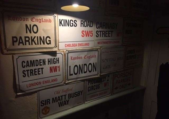 Keen to cover all wall space, there are signs right around the whole pub