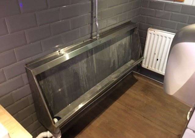 The toilet contains a traditional stainless steel trough but there’s no getting away from the fact the gents needs some serious attention