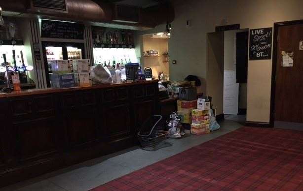 When a full scale delivery arrived it brightened up the pub – first, light came in when the side door was opened and, second, it was brought in by a guy dressed head-to-toe in bright orange hi-vis. The assorted provisions, drinks and cleaning items were left stacked against the bar.
