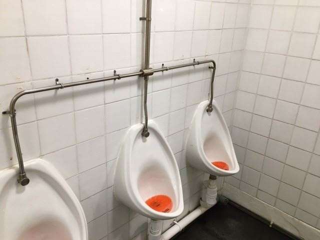 Traditional and no-nonsense with its white tiles and orange urinal mats, the gents were reasonably well maintained