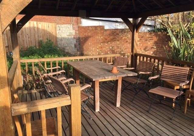 Ranged around the pub garden are a whole series of separate seating areas