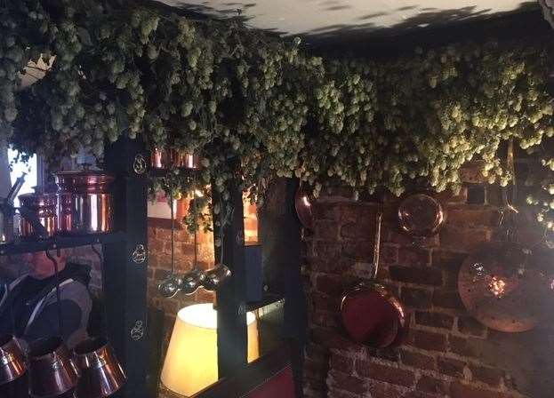Traditional Kent hops look great hung from the top of the beams – though keeping the brasses clean must be a labour of love