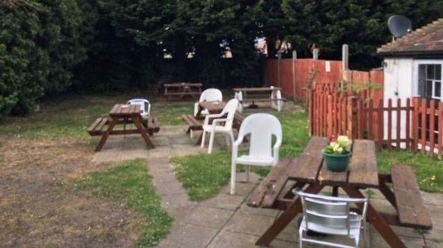 There is a garden at the back of the pub with a selection of picnic tables and assorted plastic and metal chairs