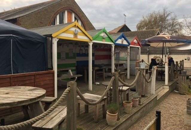 The beach-themed garden area is clearly popular and there were already several people enjoying the fresh air – they were all wearing coats though
