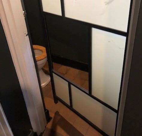 The lightweight door on the toilet cubicle has been crafted from a selection of translucent plastic panels, though a crucial missing piece might compromise your privacy