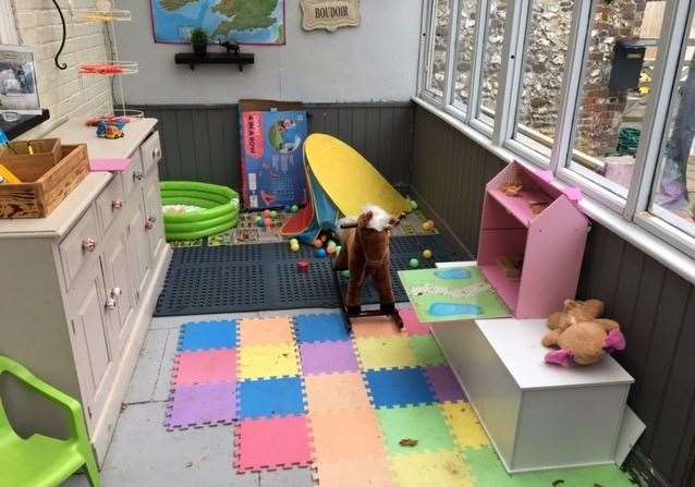 One side of a lean-to area at the back of the pub has been set aside with a number of items of play equipment to keep younger visitors happy
