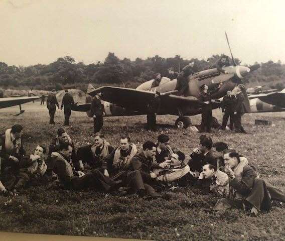 I was particularly taken by this black and white photo of an aircrew relaxing on the grass in front of their trusted aircraft