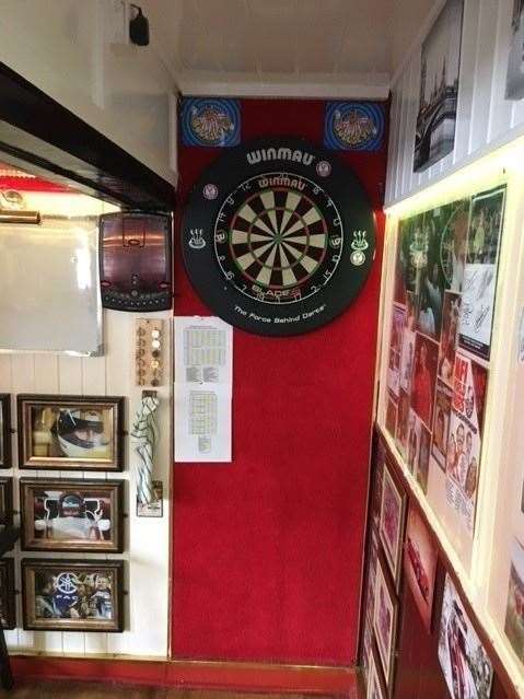 Making the very best use of limited space available, the dartboard has been carefully slotted into this tight little area at the back of the left hand side of the pub – the dart team was playing later that evening, but were away to Kemsing