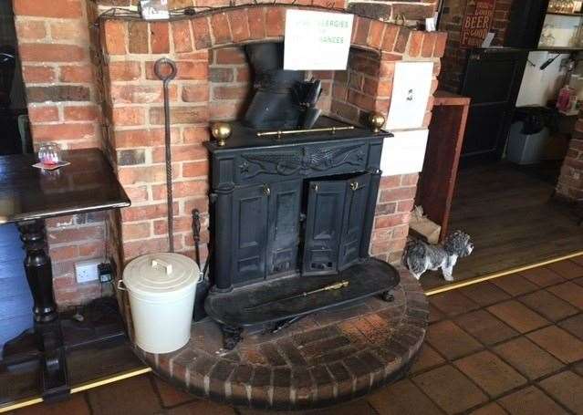 There are several log burners in the pub and sneaking a look inside I noticed this one is already set and ready to be lit