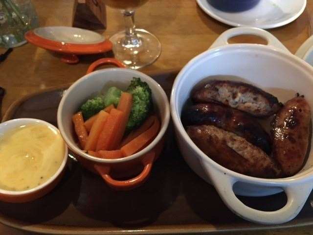 The big reveal – the largest white pot contained four superbly cooked sausages, the orange one had the vegetables lightly cooked in butter