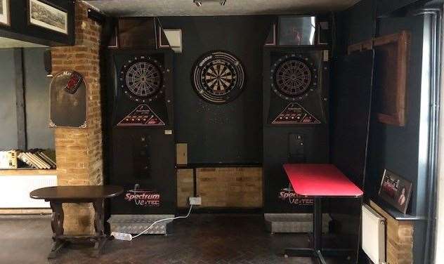 That’s quite an array of dartboards – traditional arrows in the middle with specialist soft-tip boards on either side