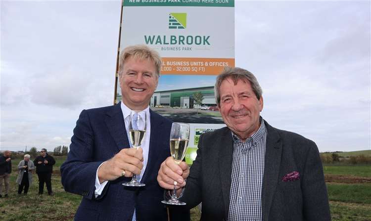 Tom Allsworth of Medichem, left, and MP Gordon Henderson toasting the launch of Walbrook Business Park at Neats Court, Queenborough