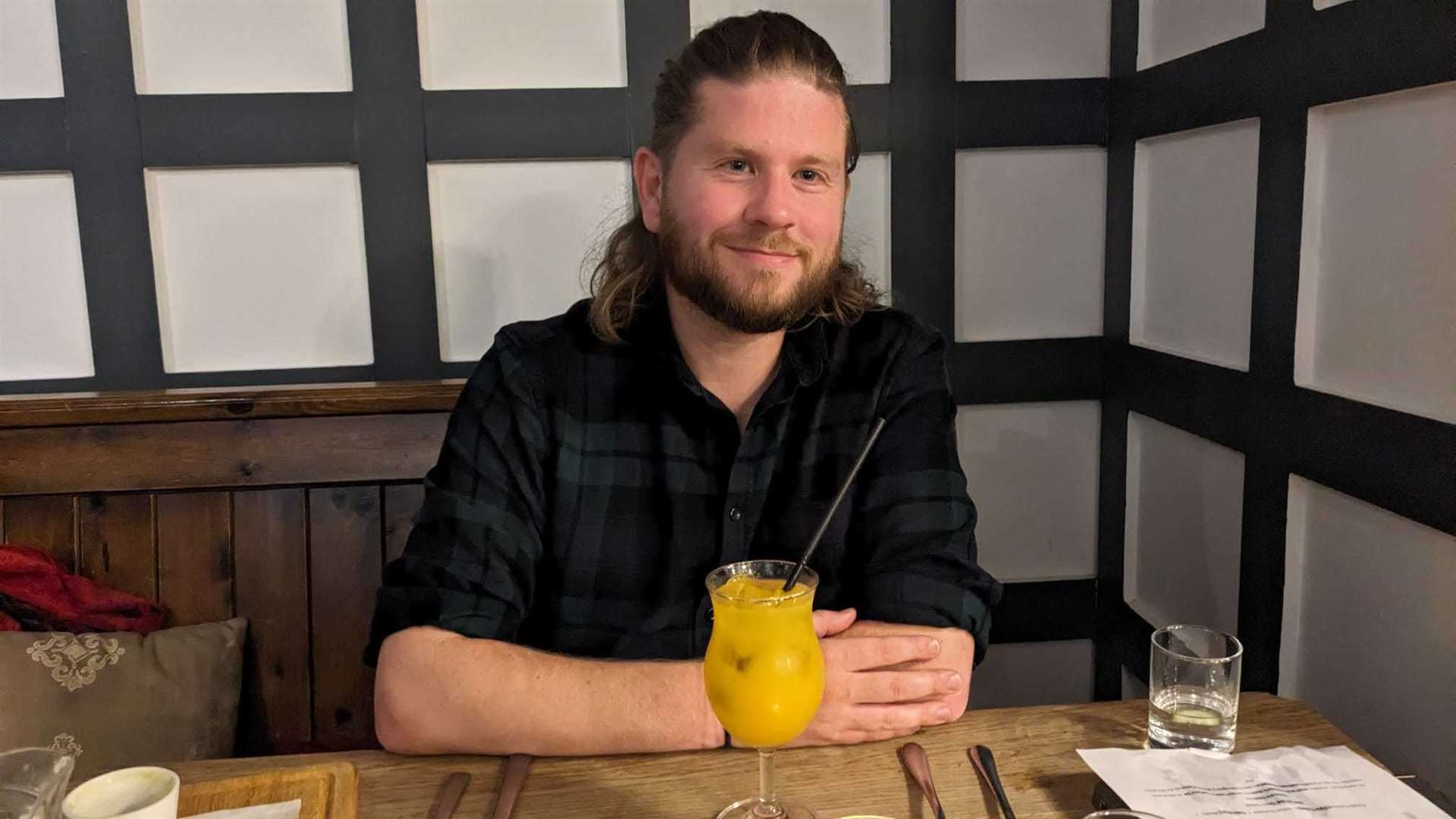 Reporter Rhys Griffiths with his mango punch at The Cook’s Tale bottomless thali night