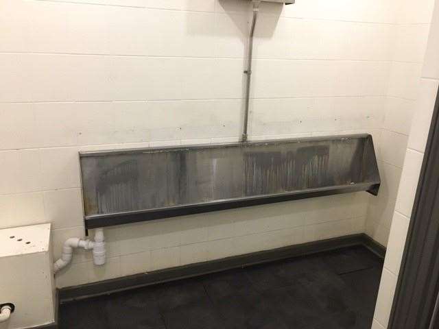 The gents have been retiled fairly recently but the more traditional stainless steel urinal trough, and a tell-tale odour, has been retained